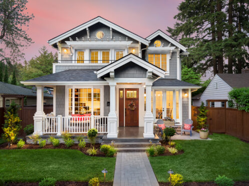 A beautiful, well-lit Indiana home at dusk.