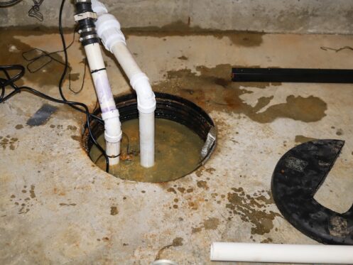 A sump pump in a home basement-plumbing repair